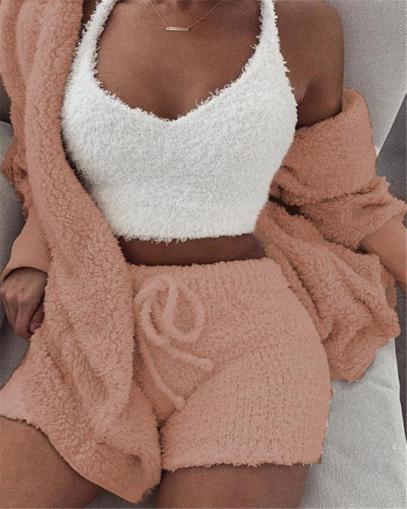 A 3‑piece women’s loungewear set that blends soft comfort with simple elegance. A long‑sleeve crop top, a lightweight tank, and drawstring shorts for a relaxed, confident look at home.