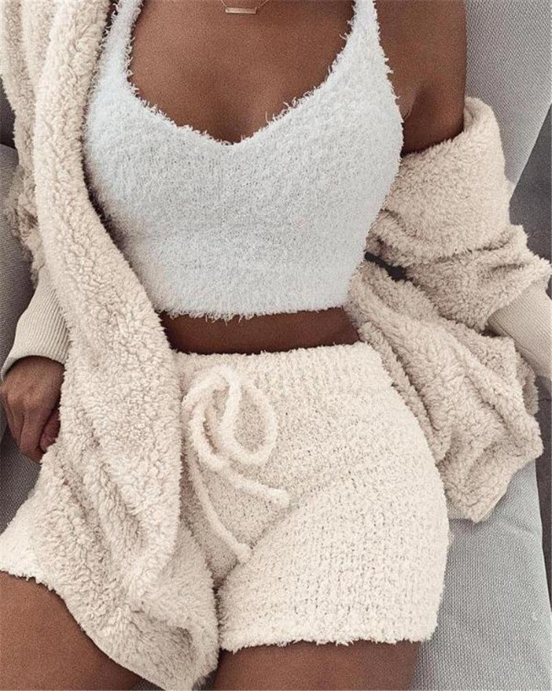 A 3‑piece women’s loungewear set that blends soft comfort with simple elegance. A long‑sleeve crop top, a lightweight tank, and drawstring shorts for a relaxed, confident look at home.